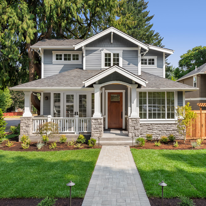 Front view of a two-story gray house - arlingtonagency.com